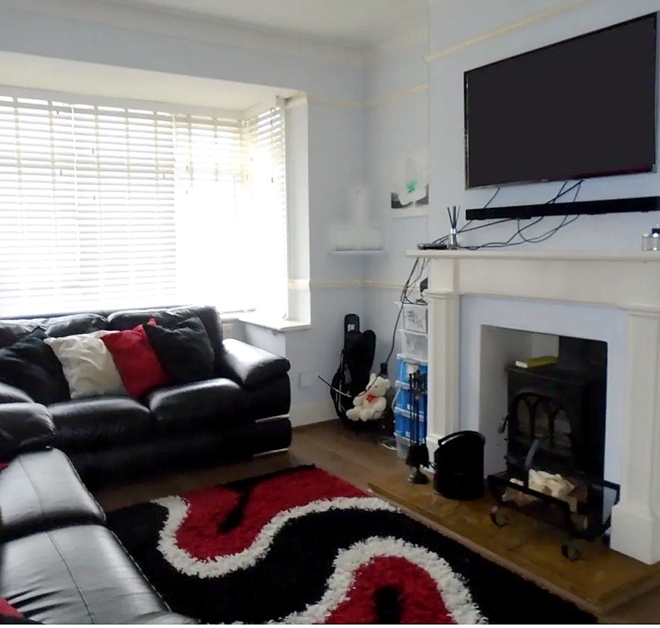 The living room before: dated decoration and tired finishes
